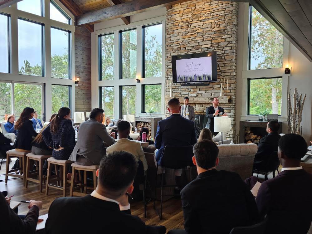 Business professionals attending a seminar about market expansion.