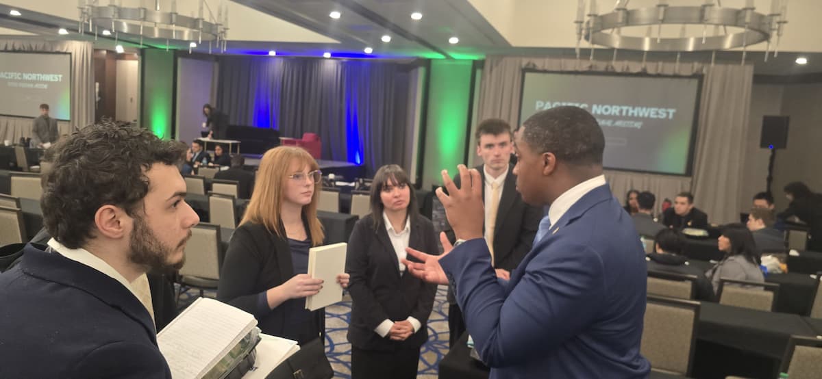 Group of professionals having a peer mentorship in a seminar.